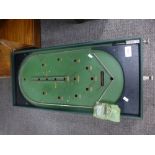 An old bagatelle board with green rexine case