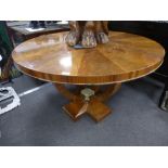 A circular Art Deco style walnut veneered centre table 120cms