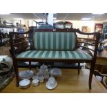 An Edwardian mahogany inlaid settee on a square splayed legs