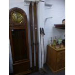 A pair of vintage wooden skis by Players Sports Ltd and a pair of Bamboo sticks with leather