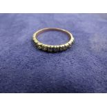 Antique rose coloured metal half eternity ring set with 13 old cut diamonds, unmarked size N/O