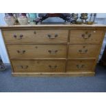 An Old pine ch with six drawers on a plinth base 135cms