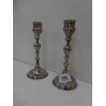 Pair of silver candlicks with turned columns and stepped circular bases, stamped 925, 15.5cm high,