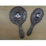 Early 20th Century silver backed hand mirror and hair brush with ribbon and vine decoration, Cher