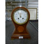 An Edwardian inlaid mahogany balloon clock