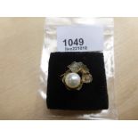 14 carat gold dress ring set with a pearl