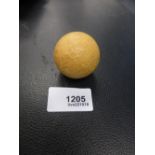 Old yellow golf ball