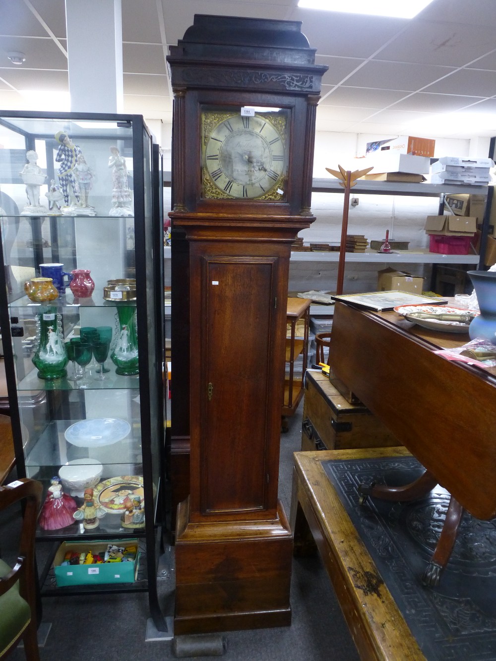 An antique oak longcase having 26cm brass dial by Fordham, Braintree, 30 hours