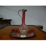 Cranberry glass liquor set on silver plated tray