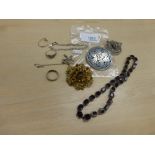 Small quantity of costume jewellery including mauve glass necklace, paste set brooches, pewter