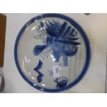 Oriental blue and white plate decorated figure by a house