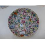 Oriental floral painted dish, characters to the base, chip to the rim