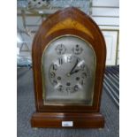 An Edwardian inlaid mahogany chiming mantle clock with an arched top, 41cms