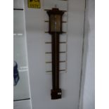 An antique mahogany stick barometer, 94cms.