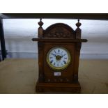 Fattomni & Sons, an early 20th Century oak mental clock having automatic alarm