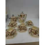 A Continental part teaset of Art Nouveau style decorated with children surrounded by flowers