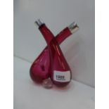 A Cranberry glass Oil-Vinegar bottles, hallmarked, silver collars