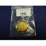 Gold full Sovereign, Edward VII, dated 1909, with yellow coloured metal mount, gross weight 10.6g