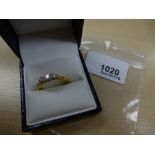 3 Stone diamond ring on an 18ct yellow gold shank stamped 750, size Q/R