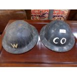 Two World War II era tin helmets