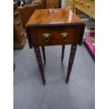 An antique mahogany Pembroke table having one drawer on turned legs.