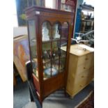 An Edwardian mahogany pillar display cabinet on splay legs, 66cms