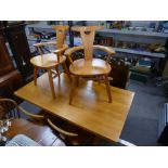 Robin Nance St Lues, a pine refectory table on supports and a set of six pine dining chairs to