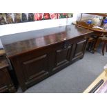 An 18th Century Oak Coffer with panelled front and sides, 164 cms