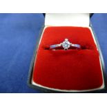 Solitaire diamond ring on abn 18ct white gold shank stamped 750, approx. 0.2ct Size O