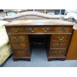 An old mahogany twin pedestal desk having 9 drawers, 106cms.