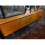 A 1970's White & newton teak sideboard having 3 drawers from 'The Petersfield' range 208cms.