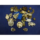 Collection of military items including brass uniform buttoned cap badges etc.