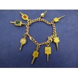 9 carat rose gold bracelet hung with various old French & English watch keys, some inset with