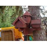 An old dovecote having five individual boxes with feeding table below.