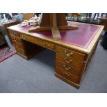 An early 20th Century twin pedestal partner's desk having nine drawers with cupboards to rear, 182