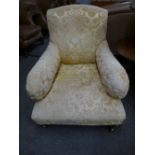 A Victorian Howard style arm chair probably by Jas Shoolbred, damage to 1 leg