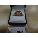 Gents yellow coloured metal dress ring set 3 rubies and 6 small diamonds, marked on outer shank,