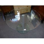 After Jasper Conran, a circular glass dining table with metal column support 100cms