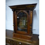 A late 19th century German walnut upright Polyphon by Schutz Mark having glazed door with drawer