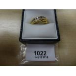 18ct yellow gold twist style ring inset with 7 diamonds one A/F, shank stamped 750, Size L/M gross