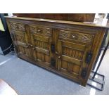 Reproduction oak sideboard with carved decoration