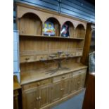 Stripped pine dresser with panelled rack, kennels & 6 mini drawers above cupboards & 3 waist drawers