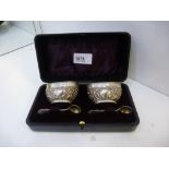 Pair of silver salts embossed with acanthus and leaves and flowers, Birmingham 1900 with a pair of