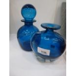 A Mdina Glass Blue Decanter with Stopper: to include a Mdina blue glass vase, 14cm high, both etched