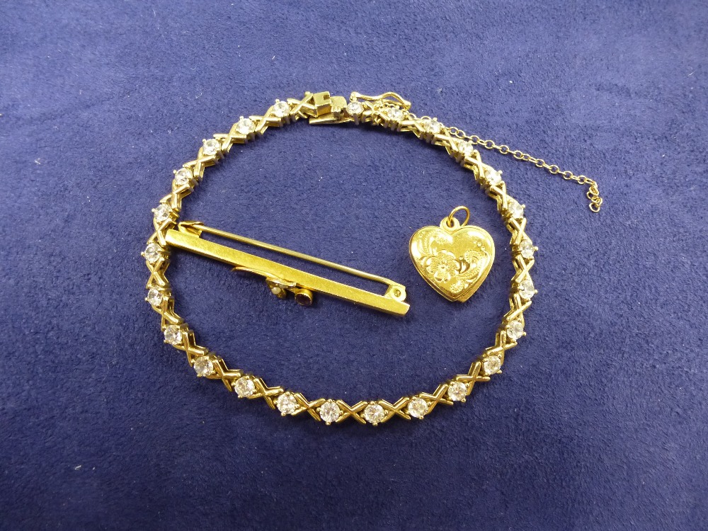 9ct yellow gold bracelet set with white coloured stones stamped 375, 9ct yellow gold bar brooch