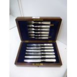 Set of 6 silver plated fruit knives and forks with mother of pearl handles in a small oak case