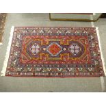 A modern geometric style rug having three central medallions. 205 X 115cms