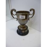 1930s Plain silver double handled trophy cup, London 1939, 8.6 troy oz on an ebonised stand