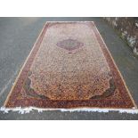 Modern Persian style carpet with central spandrel in a peach field 384x200cm