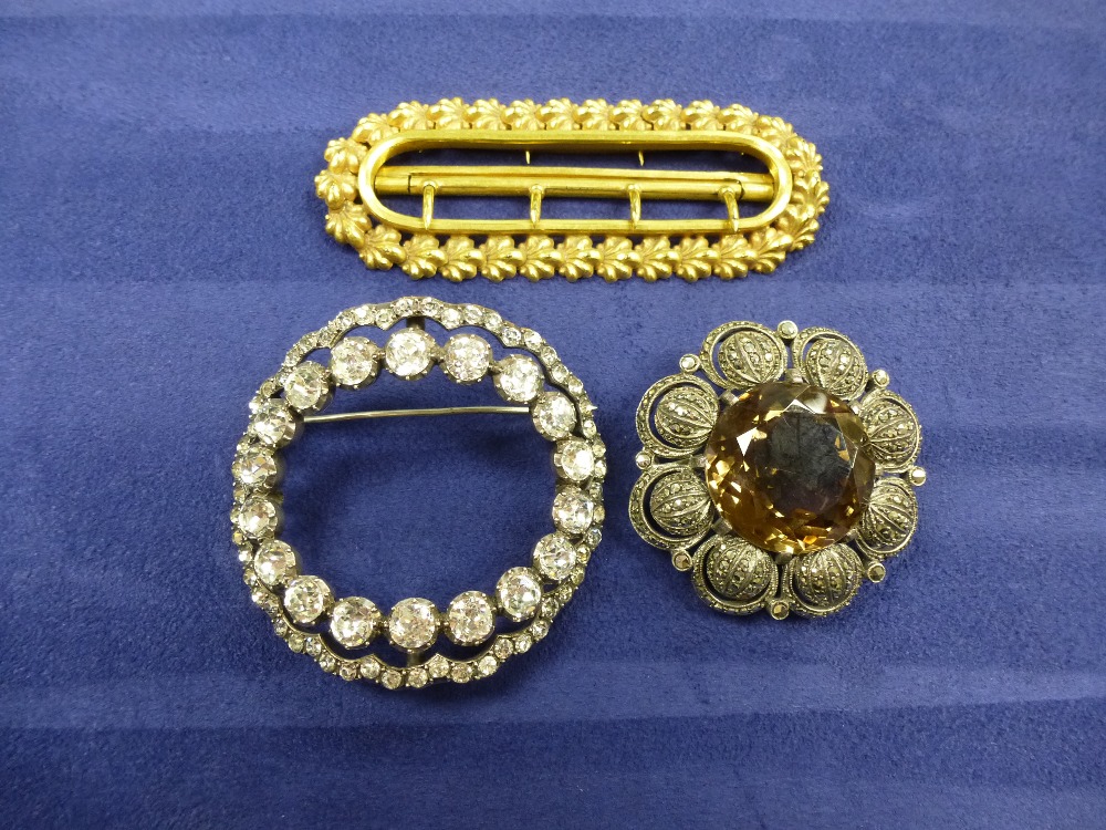 Silver and marcasite brooch with a large smokey quartz, paste brooch and a gilt metal buckle